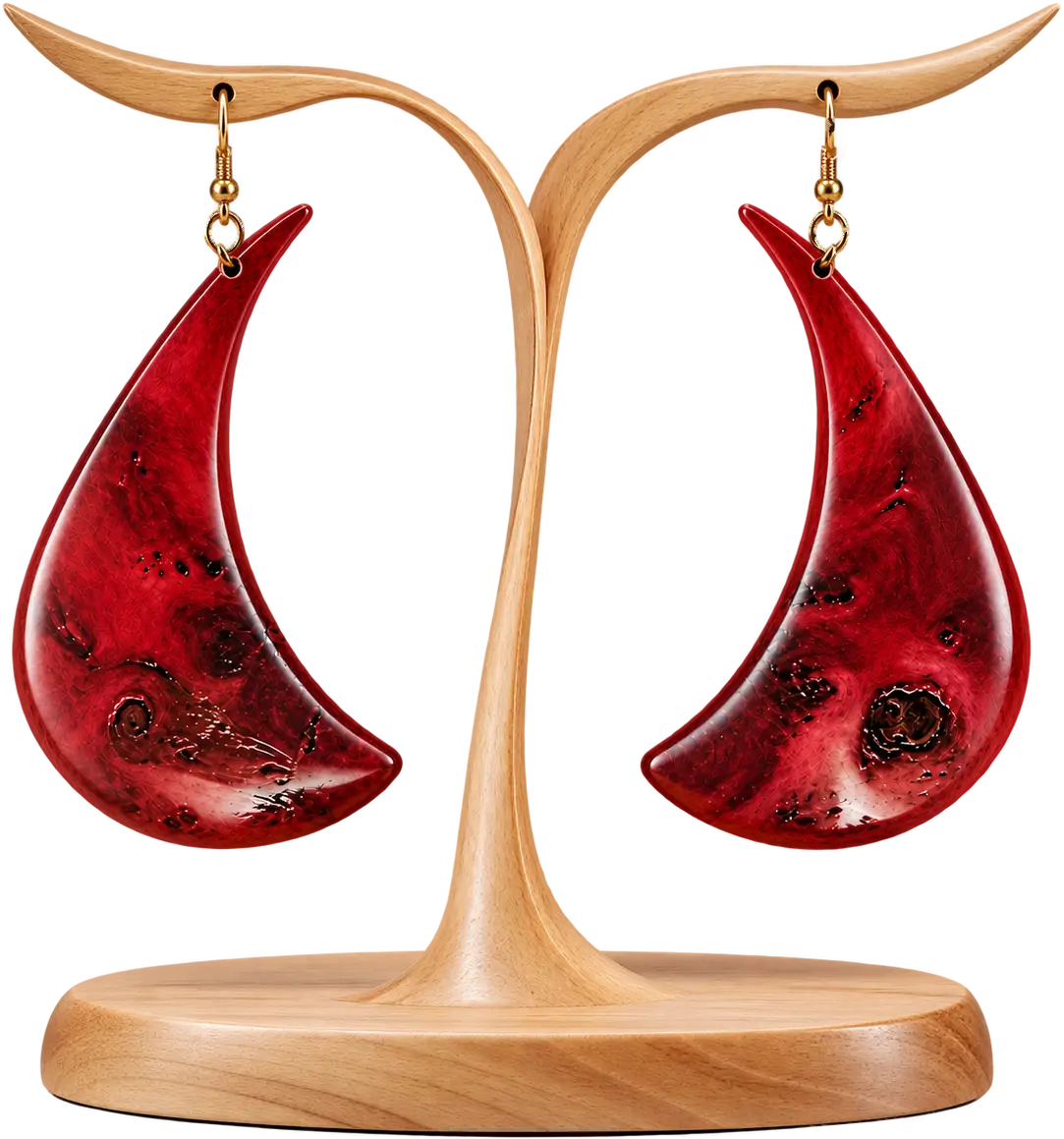 Brasa Viva. Flame-shaped drops in red burl, their points curled.